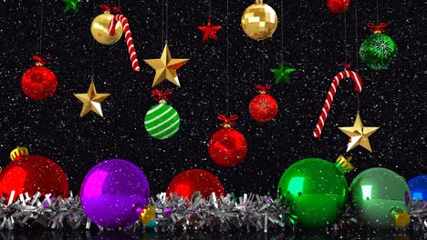 Animation-of-snow-falling-over-christmas-baubles-decorations