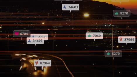 Animation-of-social-media-notifications-over-fast-motion-traffic-on-road-and-city-lights-at-sunset