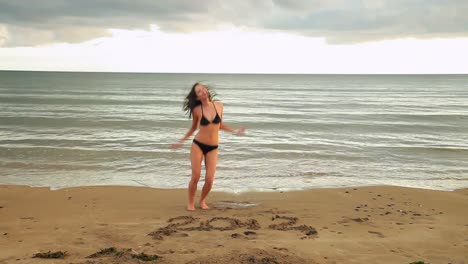 Gorgeous-brunette-dancing-around-with-2012-written-in-the-sand