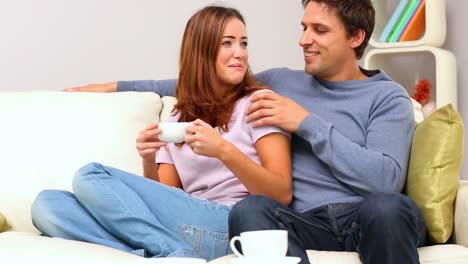 Cute-couple-relaxing-on-couch