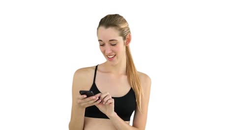 Fit-model-texting-on-her-phone