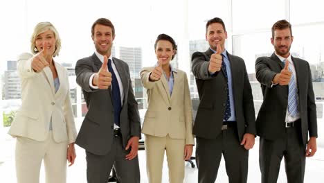 Business-people-giving-thumbs-up