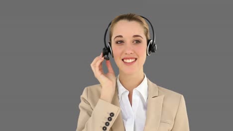 Smiling-call-centre-agent-talking-on-the-headset