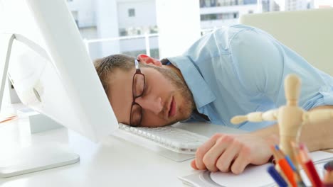 Attractive-businessman-sleeping-