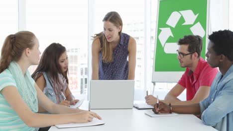 Woman-meeting-with-colleagues-about-environmental-awareness