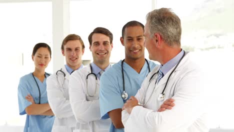 Medical-team-crossing-arms-and-looking-at-camera