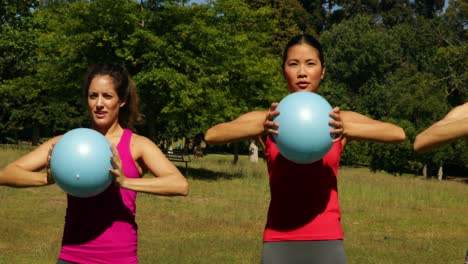 Fitness-group-working-out-with-medicine-balls