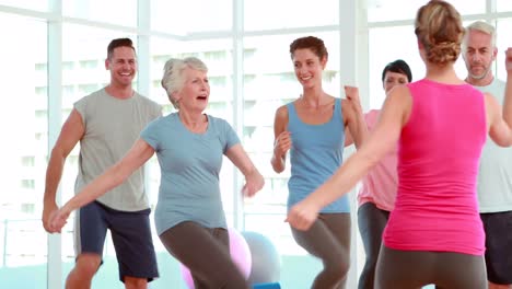 Aerobics-class-stepping-and-laughing-together