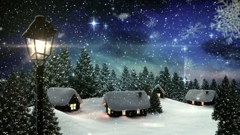 Snowflakes-falling-over-houses-and-trees-on-winter-landscape-against-shining-stars-in-night-sky