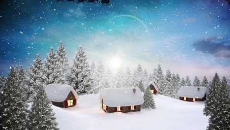 Schnee-Fällt-über-Mehrere-Häuser-Und-Bäume-In-Der-Winterlandschaft-Vor-Blauem-Himmel