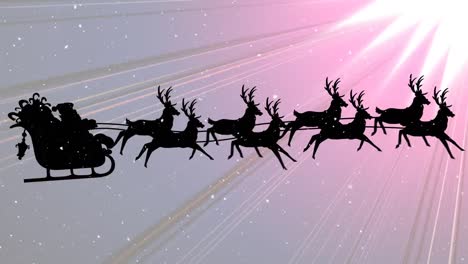 Snow-falling-on-santa-claus-in-sleigh-being-pulled-by-reindeers-and-light-trails-on-pink-background