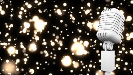 Retro-white-microphone-against-golden-spots-of-light-against-black-background