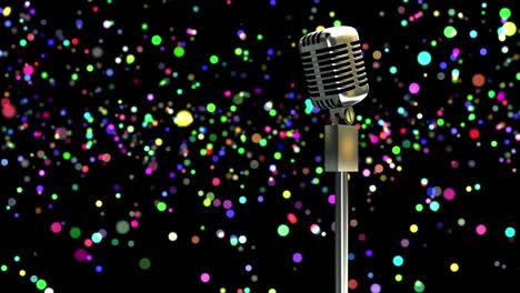 Retro-metallic-microphone-against-colorful-spots-of-light-against-black-background