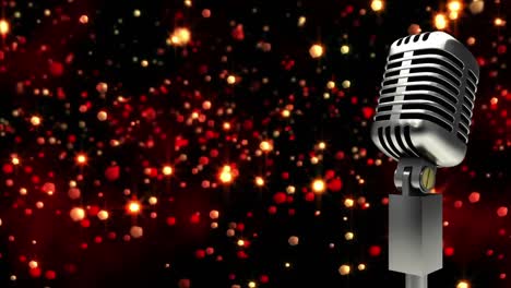 Retro-metallic-microphone-against-red-spots-of-light-against-black-background