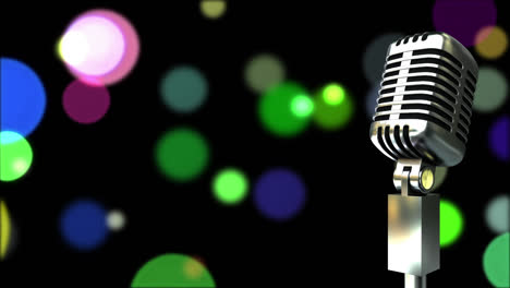 Retro-metallic-microphone-against-colorful-spots-of-light-against-black-background
