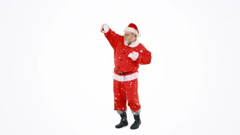 Digital-composition-of-snow-falling-over-santa-claus-dancing-against-grey-background