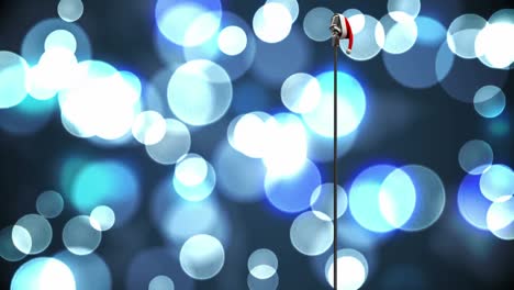 Animation-of-rerto-microphone-with-santa-hat-over-shining-bokeh