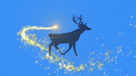 Golden-shooting-star-over-silhouette-of-reindeer-walking-against-blue-background