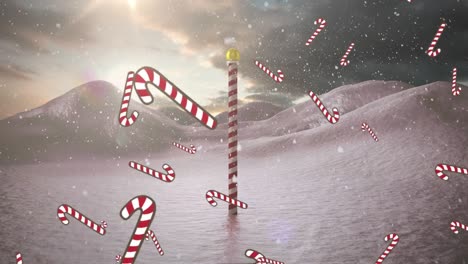 Animation-of-falling-candy-canes-over-winter-scenery-with-north-pole-sign