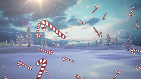 Multiple-candy-cane-icons-and-snow-falling-over-winter-landscape-against-clouds-in-the-sky