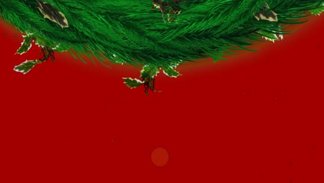 Christmas-wreath-decoration-and-red-particles-falling-against-red-background