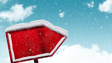 Nieve-Cayendo-Sobre-Un-Cartel-Rojo-En-El-Paisaje-Invernal-Contra-El-Cielo-Azul