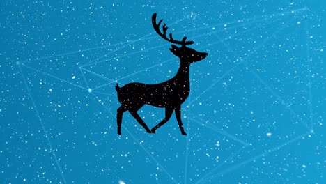 Snow-falling-over-silhouette-of-reindeer-walking-against-network-of-connections-on-blue-background