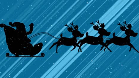 Snow-falling-over-santa-claus-in-sleigh-being-pulled-by-reindeer-and-light-trails-on-blue-background