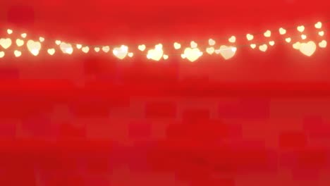 Digitale-Animation-Dekorativer-Herzförmiger-Lichterketten,-Die-Vor-Rotem-Hintergrund-Hängen