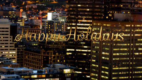 Happy-holidays-text-and-yellow-spots-floating-against-aerial-view-of-night-cityscape