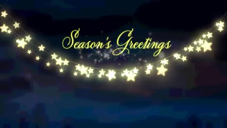Animation-of-christmas-seasons-greetings-and-glowing-fairy-lights-over-winter-landscape