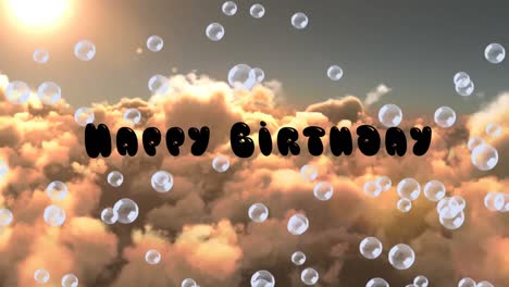 Animation-of-happy-birthday-text-and-soap-bubbles-over-cloudy-sky