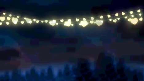 Animation-of-glowing-fairy-lights-over-winter-landscape