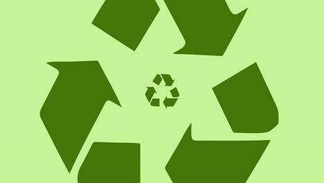 Animation-of-recycling-logo-over-green-background