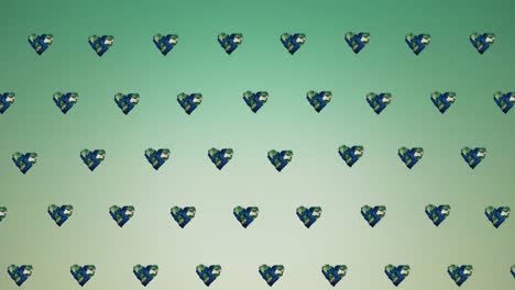 Animation-of-multiple-heart-shaped-globes-moving-on-green-background