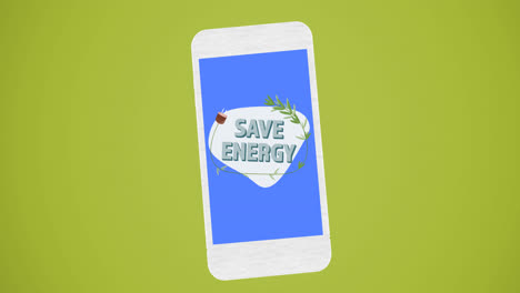 Animation-of-save-energy-text-and-logo-on-blue-smartphone-screen,-on-green-background