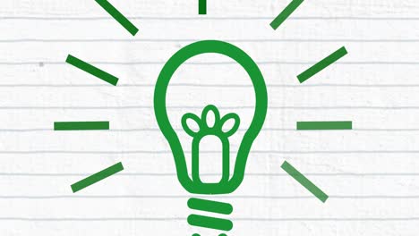 Animation-of-green-light-bulb-on-lined-paper-background