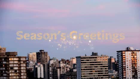 Seasons-greeting-text-over-fireworks-bursting-against-aerial-view-of-cityscape