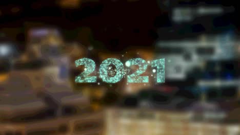 Text-Aus-Dem-Jahr-2021-über-Einem-Feuerwerk,-Das-Vor-Der-Luftaufnahme-Der-Nächtlichen-Stadtlandschaft-Explodiert