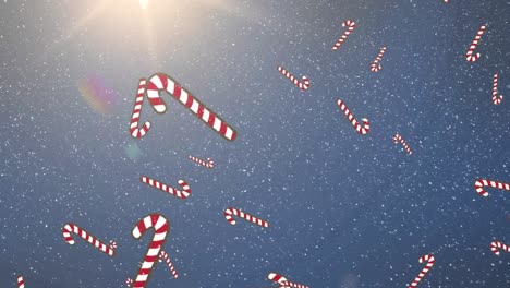 Animation-of-falling-snow-candy-cane-over-blue-background