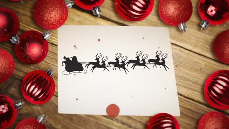 Red-particles-over-santa-claus-in-sleigh-being-pulled-by-reindeers-on-a-paper-and-multiple-baubles