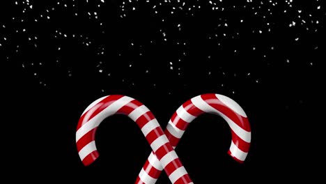 Animation-of-candy-cane-over-snow-falling