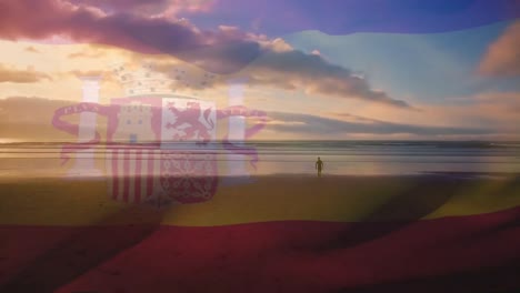 Animation-of-flag-of-spain-waving-over-person-on-beach-and-cloudy-blue-sky