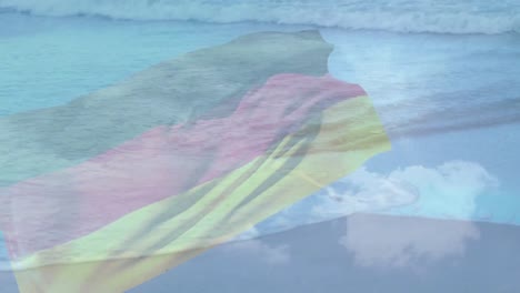 Digitale-Komposition-Einer-Wehenden-Deutschen-Flagge-Vor-Dem-Blick-Auf-Den-Strand-Und-Die-Meereswellen