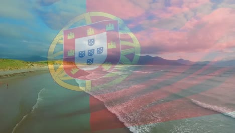 Animation-of-flag-of-portugal-waving-over-beach-landscape,-cloudy-blue-sky-and-sea