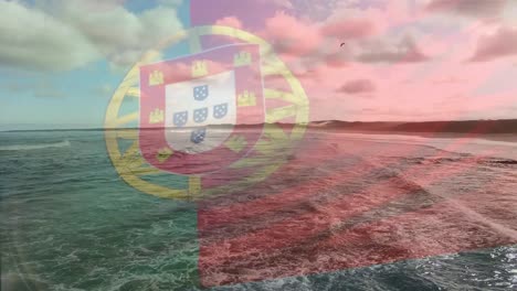 Digital-composition-of-waving-portugal-flag-against-aerial-view-of-waves-in-the-sea