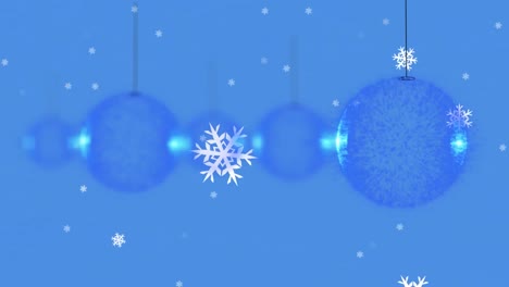 Snowflakes-falling-over-multiple-blue-bauble-hanging-decorations-against-blue-background