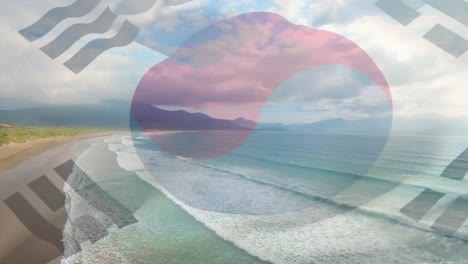 Digital-composition-of-waving-south-korea-flag-against-aerial-view-of-the-beach-and-the-sea