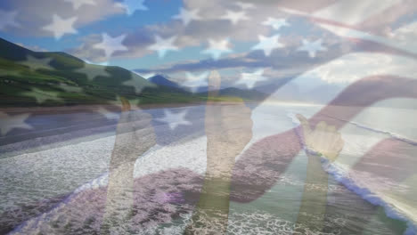 Animation-Der-Flagge-Der-USA,-Die-Mit-Einer-Geste-über-Der-Strandlandschaft-über-Die-Hände-Weht