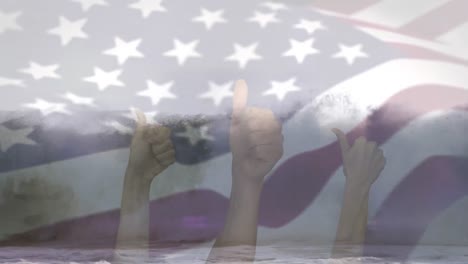 Animation-of-flag-of-usa-blowing-over-hands-in-okay-gesture-over-beach-landscape
